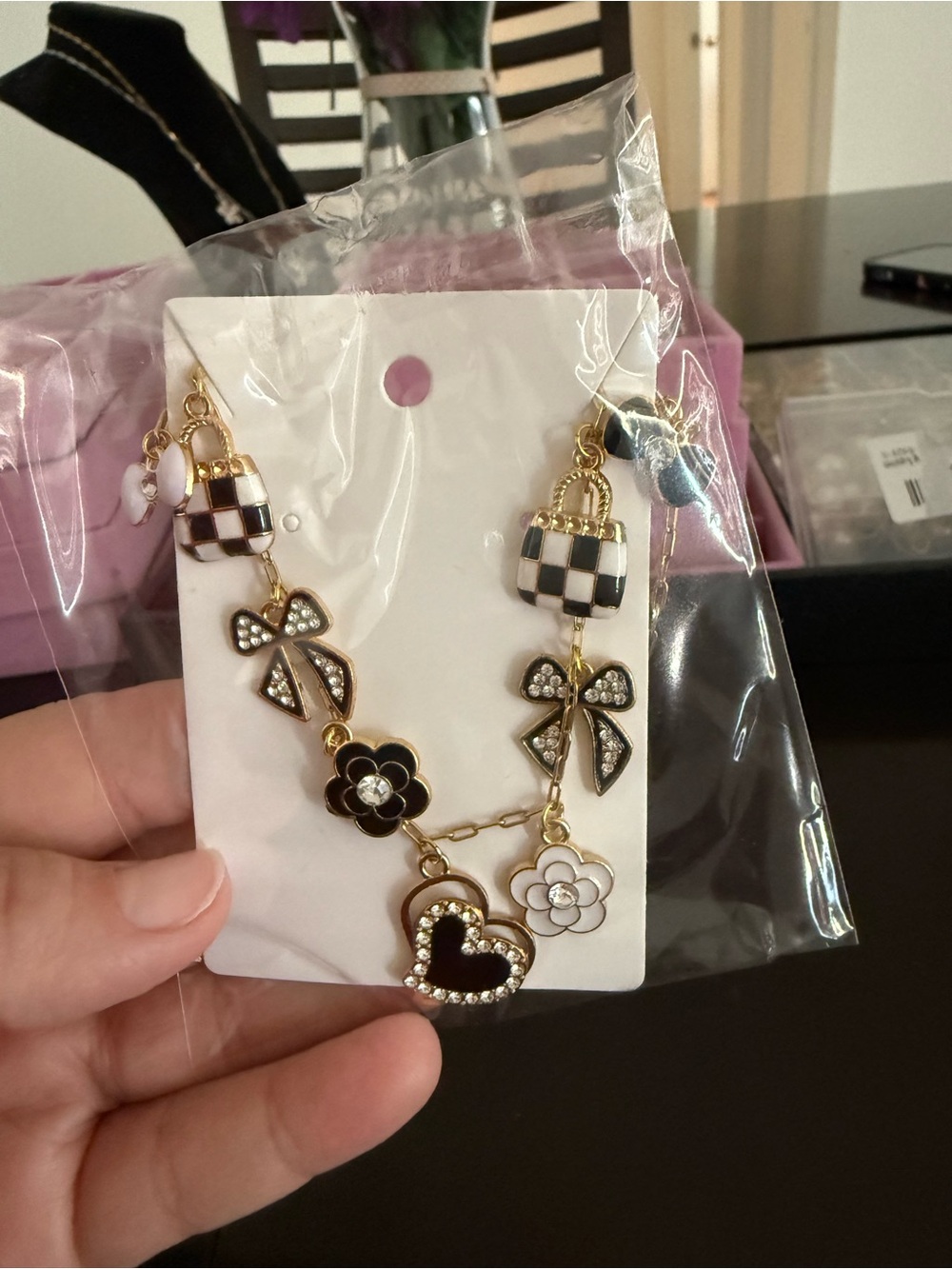Black & White Charm Necklace with Heart, Bow, and Flower Charms